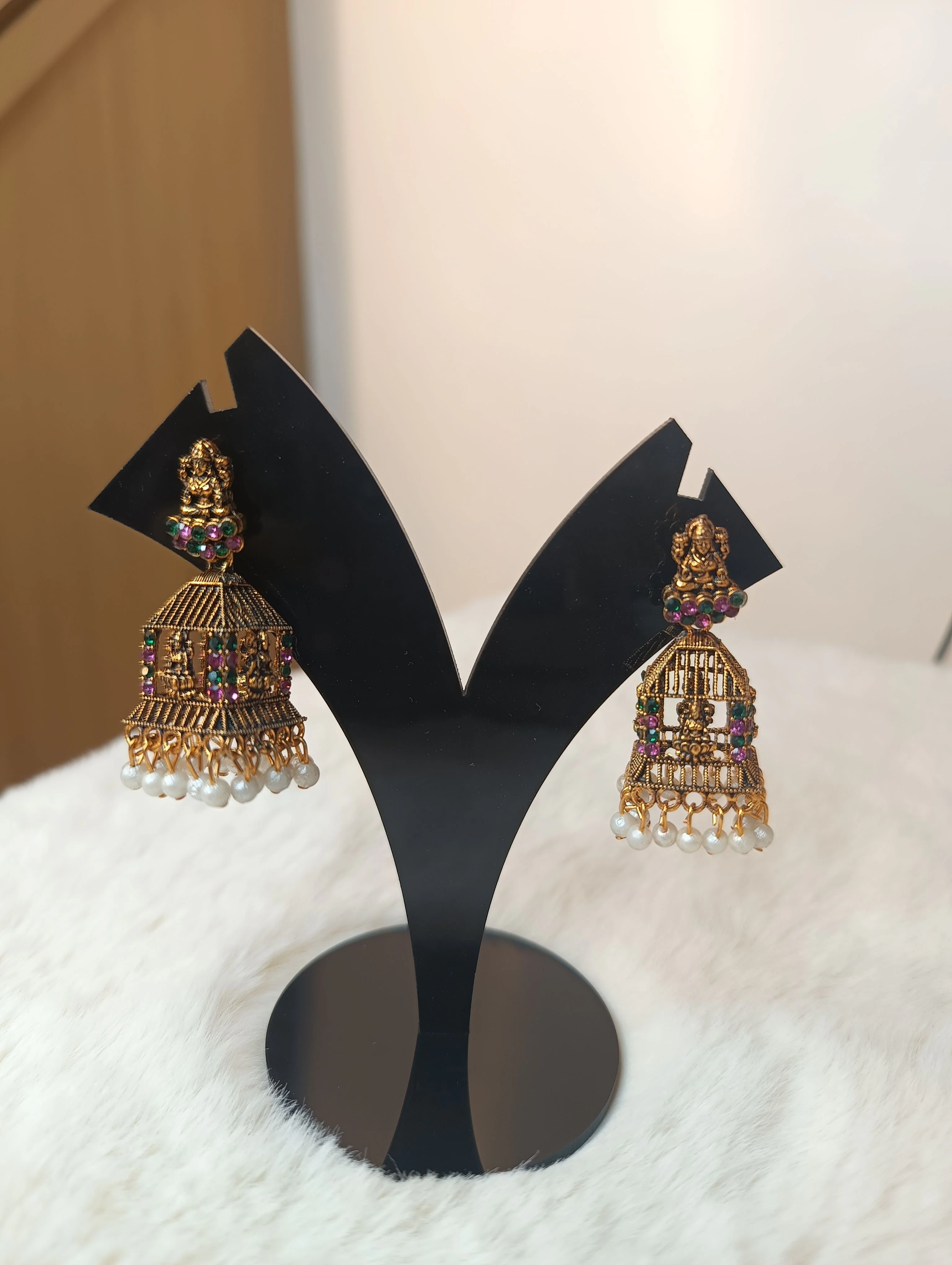 Temple-style jhumka earrings,